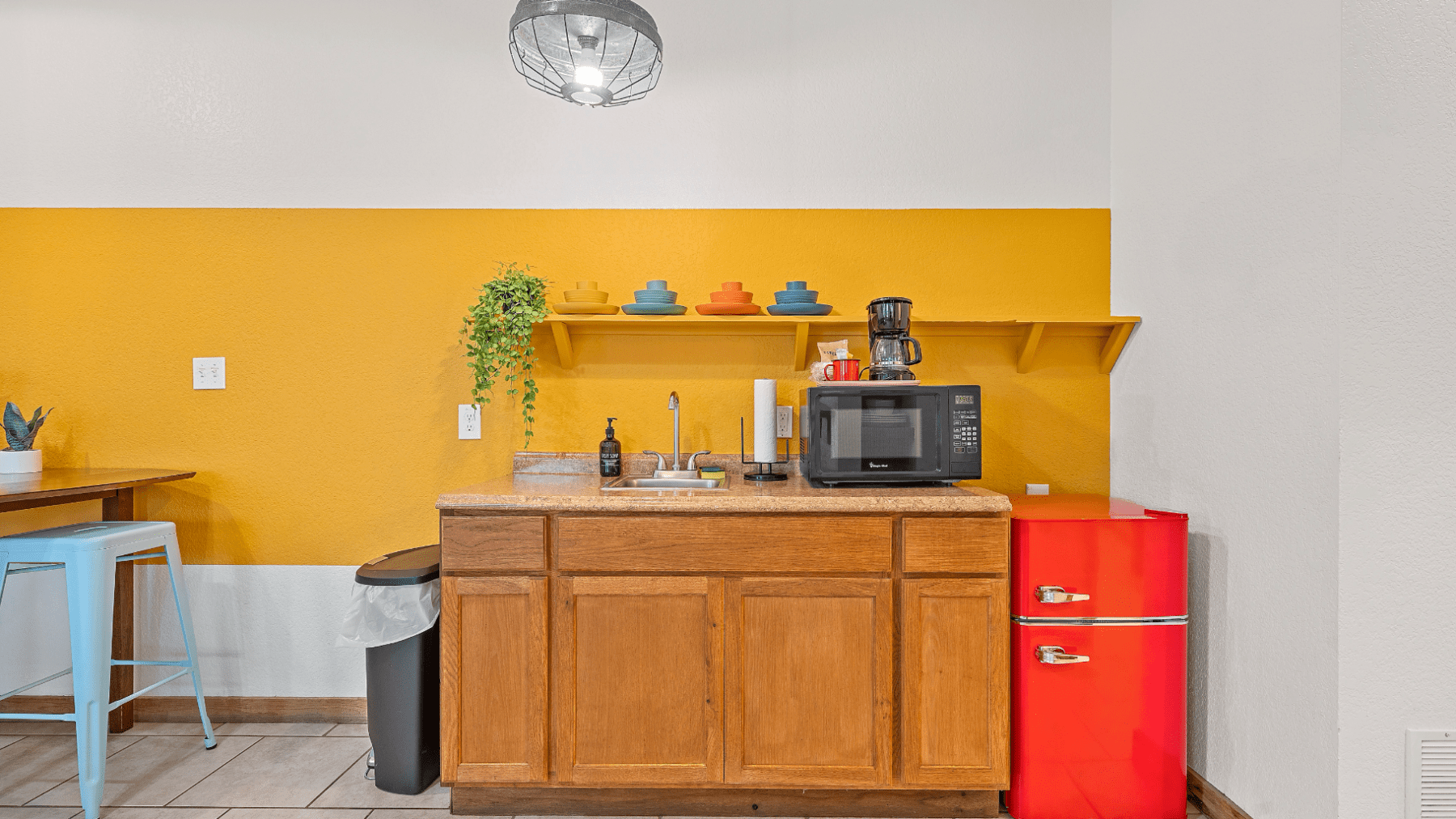 a kitchen with a clock on a table